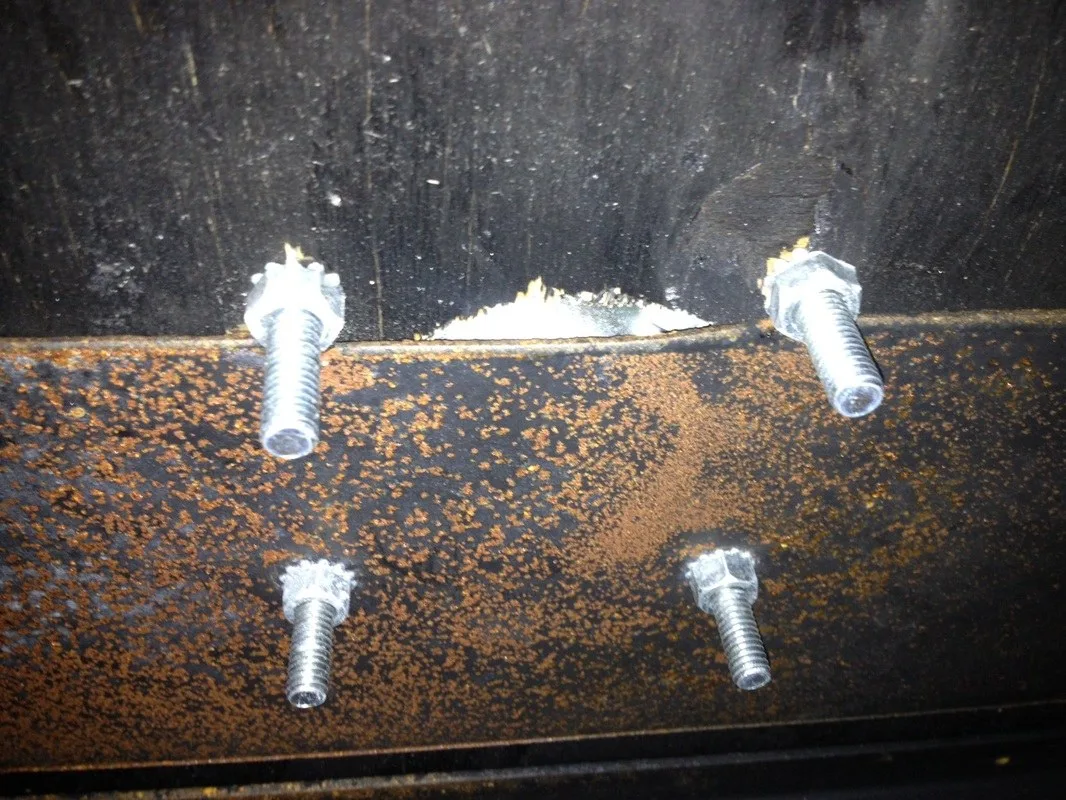 This D-ring completely missed the backing plate. The scary part: someone saw this when they tightened the nuts.