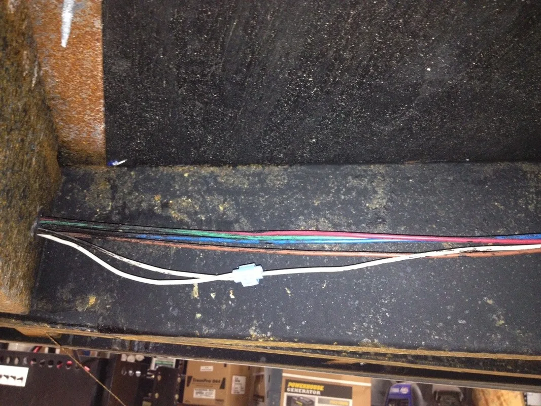 A series of loose wires and cheap scotch lock connectors make up this trailer’s lighting harness.